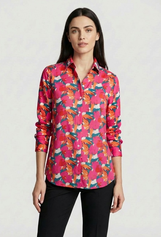Woman wearing a colorful floral shirt.